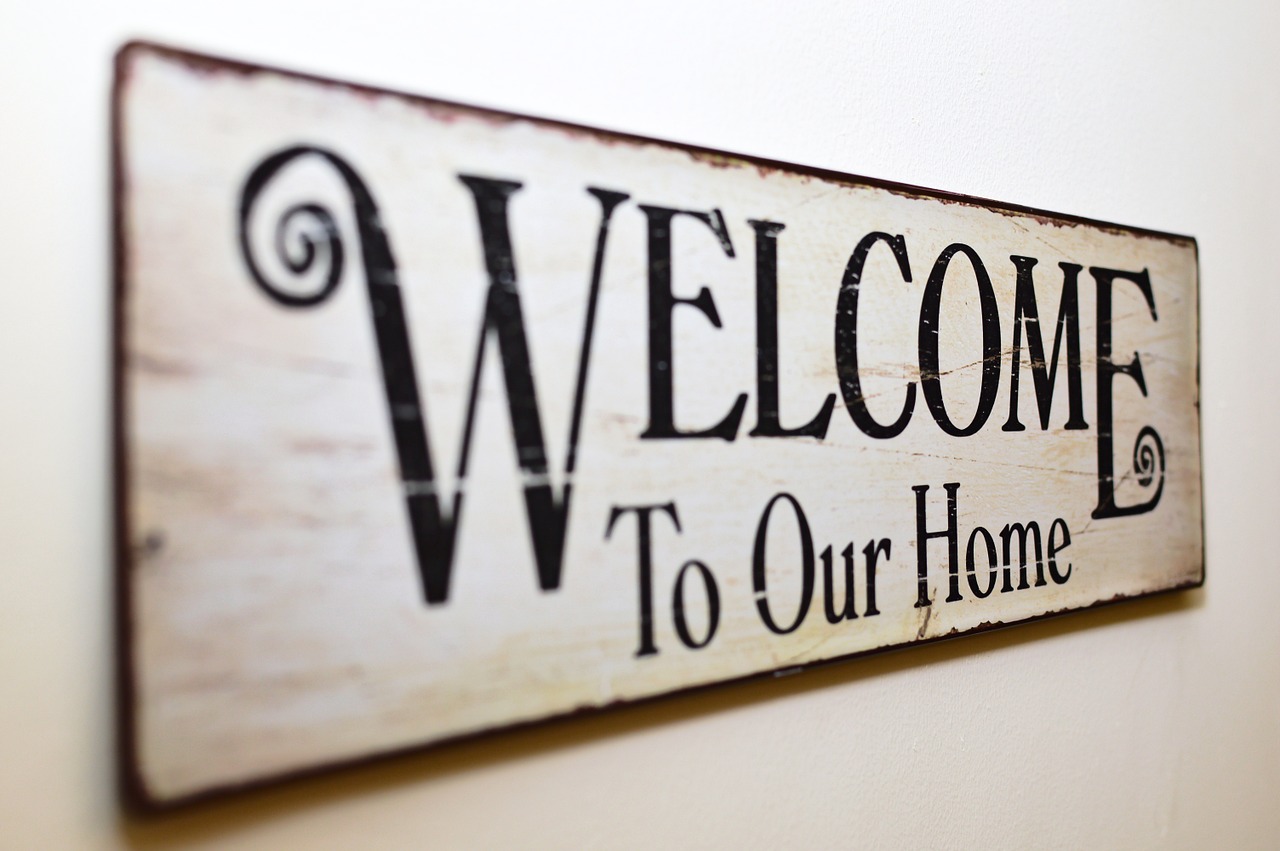 Picture of a sign that says Welcome To Our Home